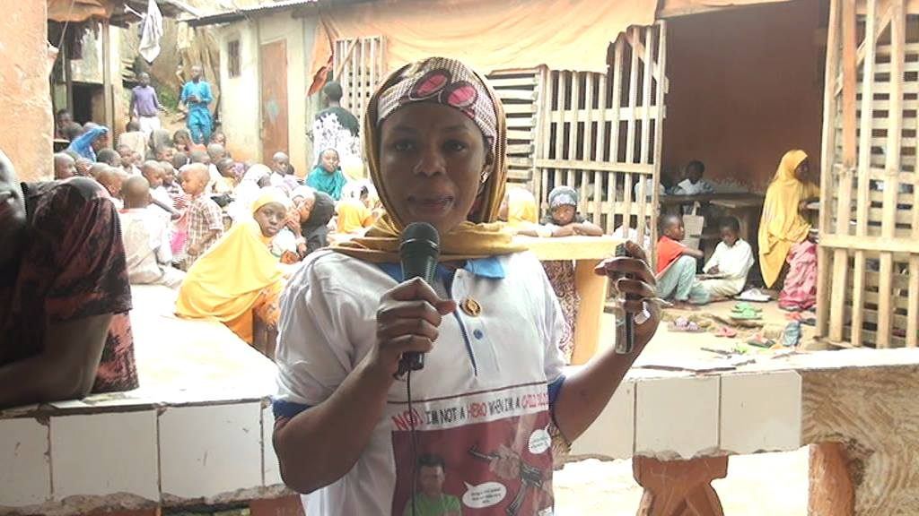 A woman speaking at an outdoor community event